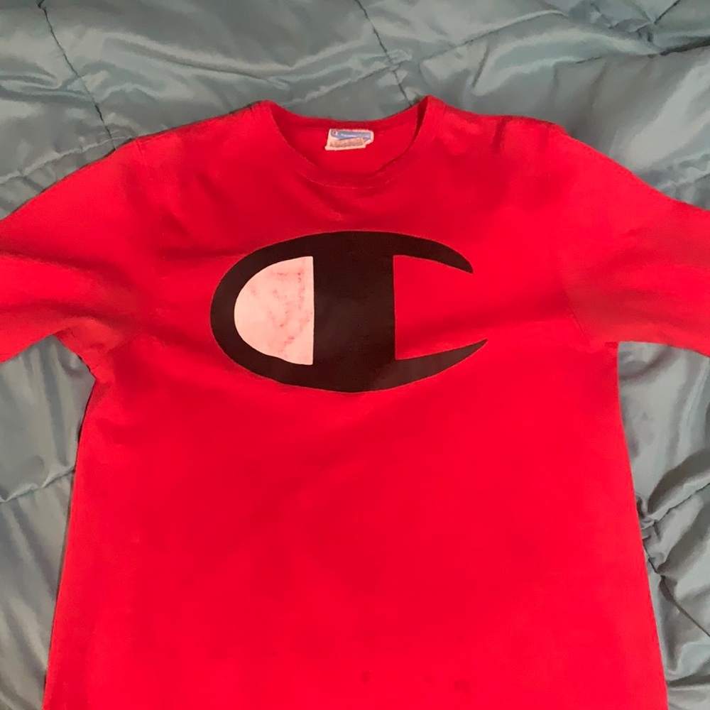 Red champion shirt size medium in men’s